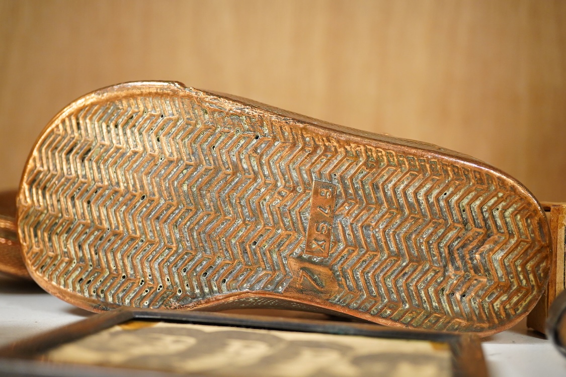 A collection of mixed metalware to include a copper plaque and brass ink blotter, together with a horn beaker